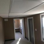 A room with two doors and a window.