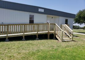 A house with a ramp leading to the front of it.