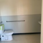 A bathroom with a toilet and sink in it