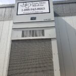 A large building with a sign on the side of it.